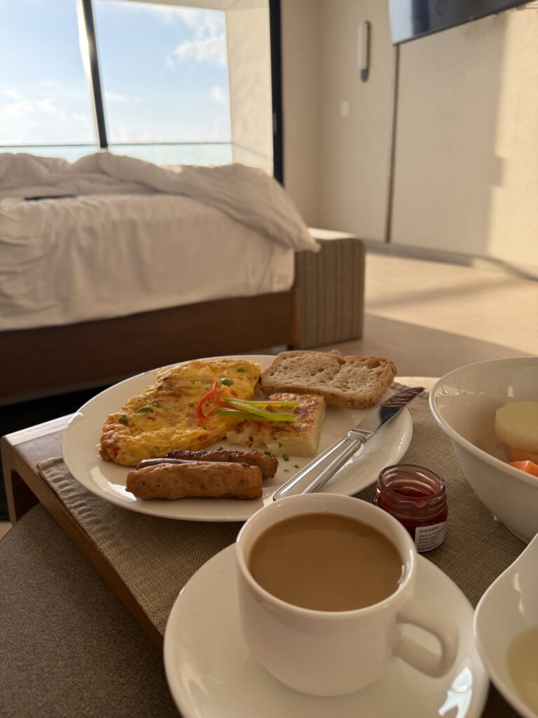 Gluten-free in-room breakfast service with omelet, hash browns, and fruit