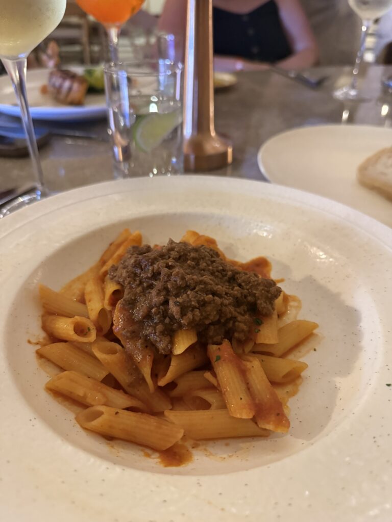 Gluten-free penne with meat sauce at a resort fine dining restaurant